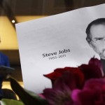 Flowers in memory of Apple co-founder Steve Jobs are seen outside an Apple Store in Central Sydney