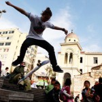 A Greek youth performs skateboard tricks in Athens