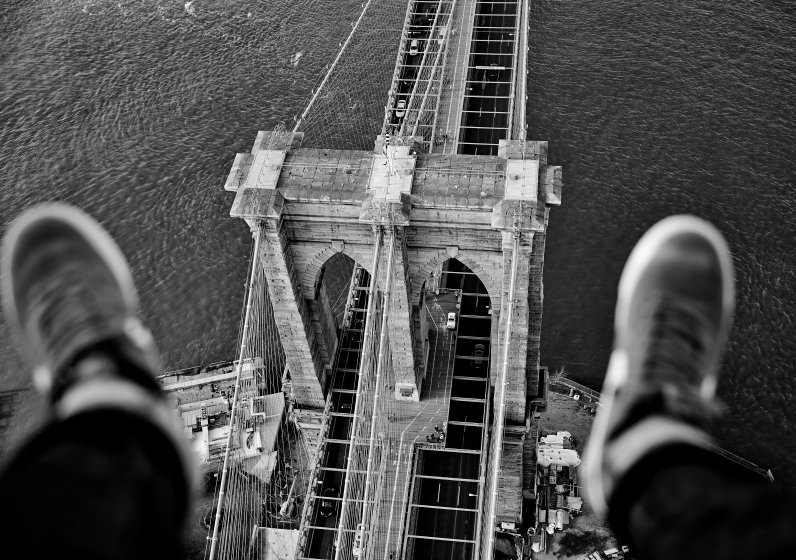 PIC BY MATT HAWTHORNE / CATERS NEWS - (PICTURED: Brooklyn Bridge.) Forget selfies, belfies and dronies... One company is offering a variation of the popular snapshot - thousands of feet above the New York skyline. Aerial photography company FlyNYON are giving snappers the chance to take stomach-churning pictures of their limbs, hanging out of a helicopter above famous New York landmarks. The shot - known by the company as a "shoe selfie - has become a huge hit, with legs being snapped over the likes of the Empire State Building, Central Park, Times Square and Freedom Tower. Thanks to the help of social media, FlyNYON, who are based in Kearney, NJ, have seen interest in the experience boom. SEE CATERS COPY