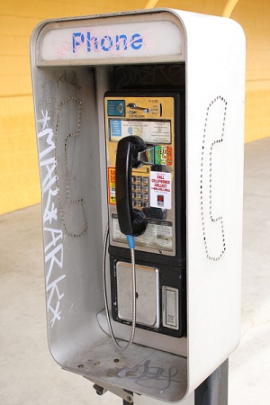 pay-phone-booth-with-grafitti
