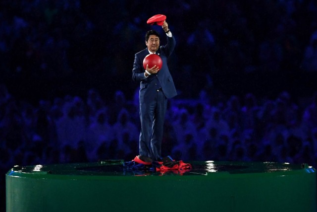 RIO DE JANEIRO, BRAZIL - AUGUST 21: Japan Prime Minister Shinzo Abe appears during the 'Love Sport Tokyo 2020' segment during the Closing Ceremony on Day 16 of the Rio 2016 Olympic Games at Maracana Stadium on August 21, 2016 in Rio de Janeiro, Brazil. (Photo by David Ramos/Getty Images)