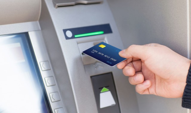 Man Puts Credit Card Into Atm