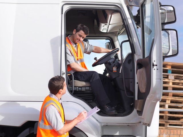 Truck driver and dispatch worker talk